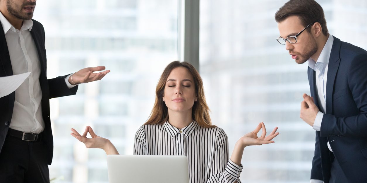 Calm female managing stress at workplace not involved in fights