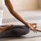 Yogi black woman practicing yoga lesson, doing Ardha Padmasana exercise Meditation Session Brisbane - Haven Yoga & Meditation - Murarrie QLD