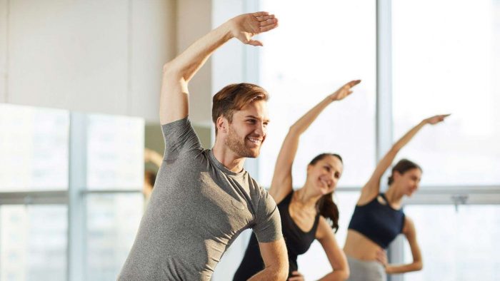 Men-Yoga Men and Group of Ladies Doing Yoga - Haven Yoga & Meditation Blog Image