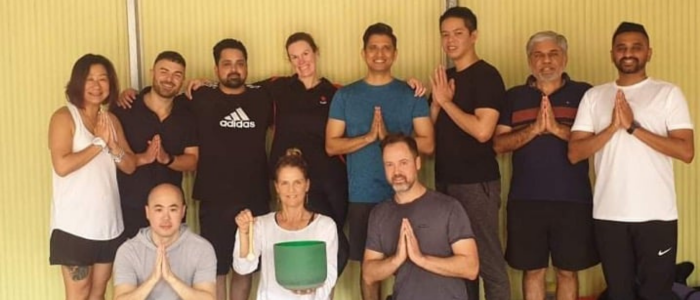 Corporate yoga Blog NAB A group of employees in a yoga studio - Corporate Yoga blog image