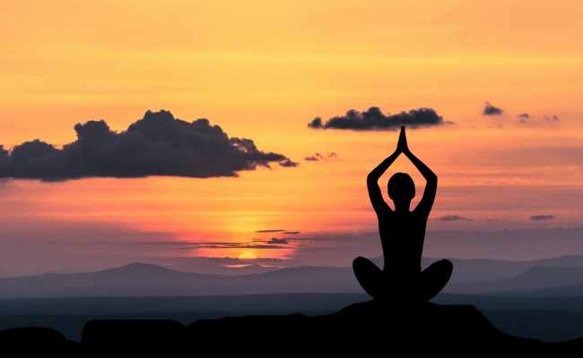 Haven Email Banners (650 × 400 px) Person doing yoga on a hilltop sunset - Haven Yoga and Meditation